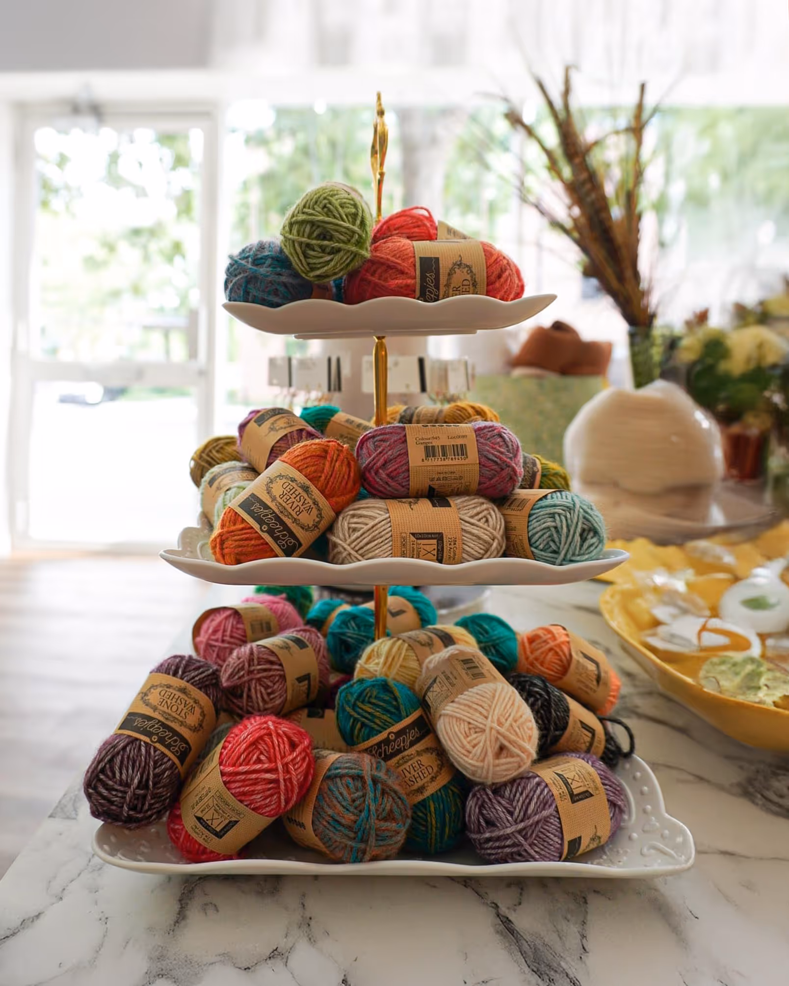 A display with bales of wool in different colours